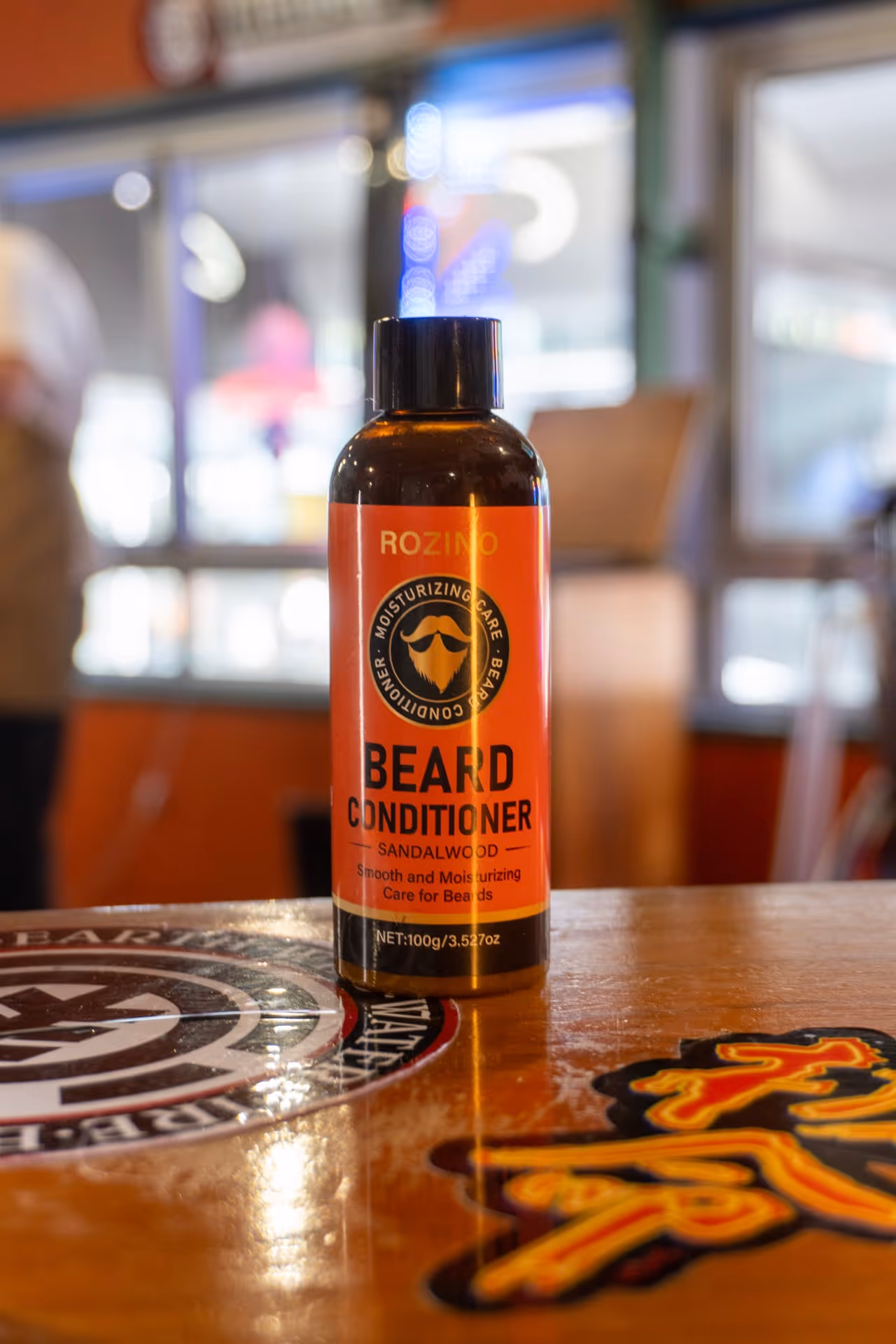 a bottle of beard conditioner on a table