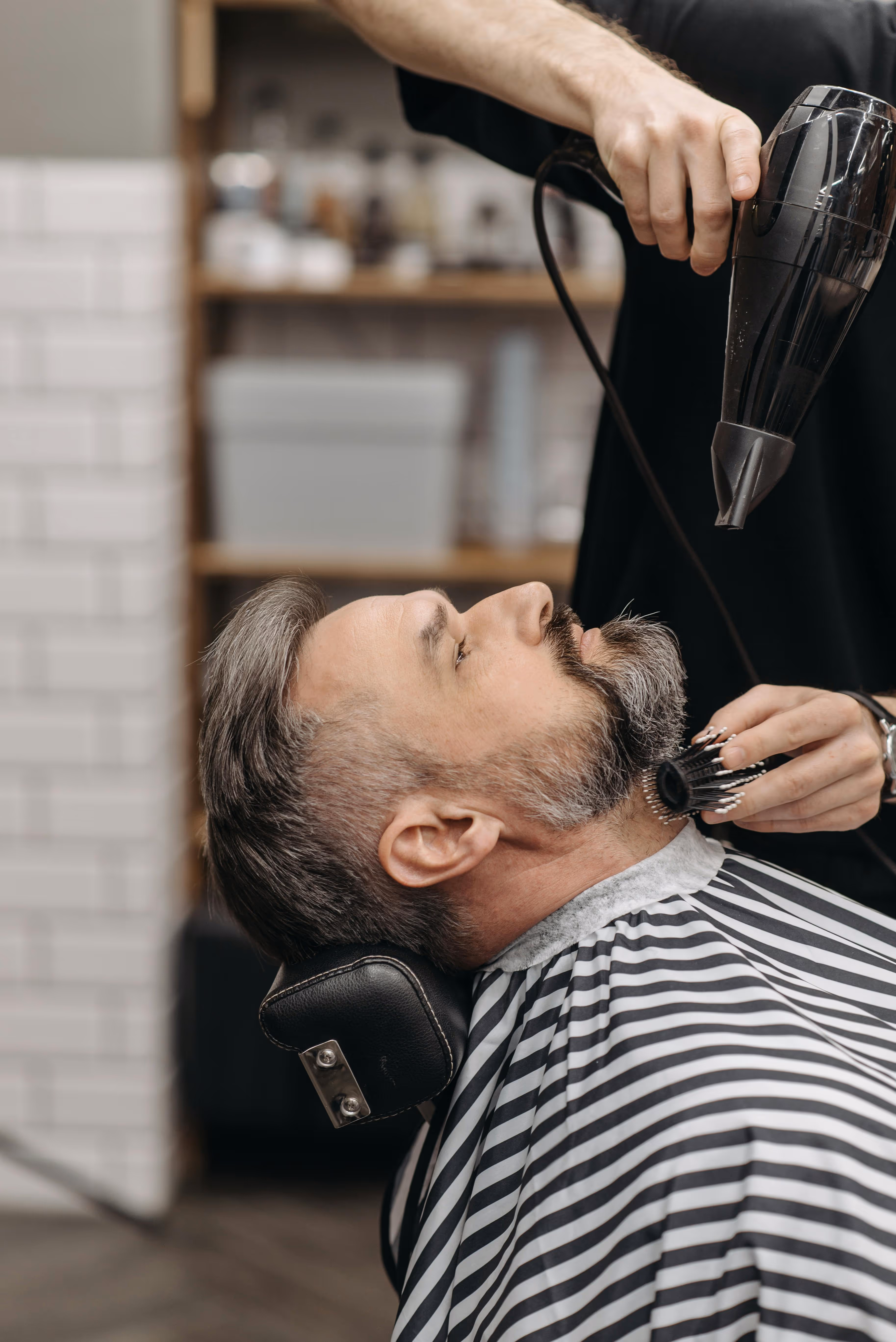 Man getting beard blow-dried