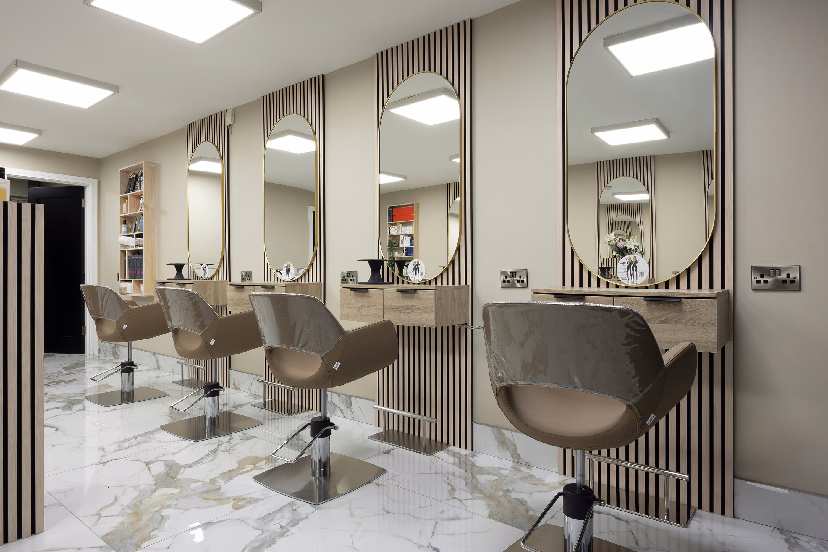 Modern hair salon with mirrors and styling chairs